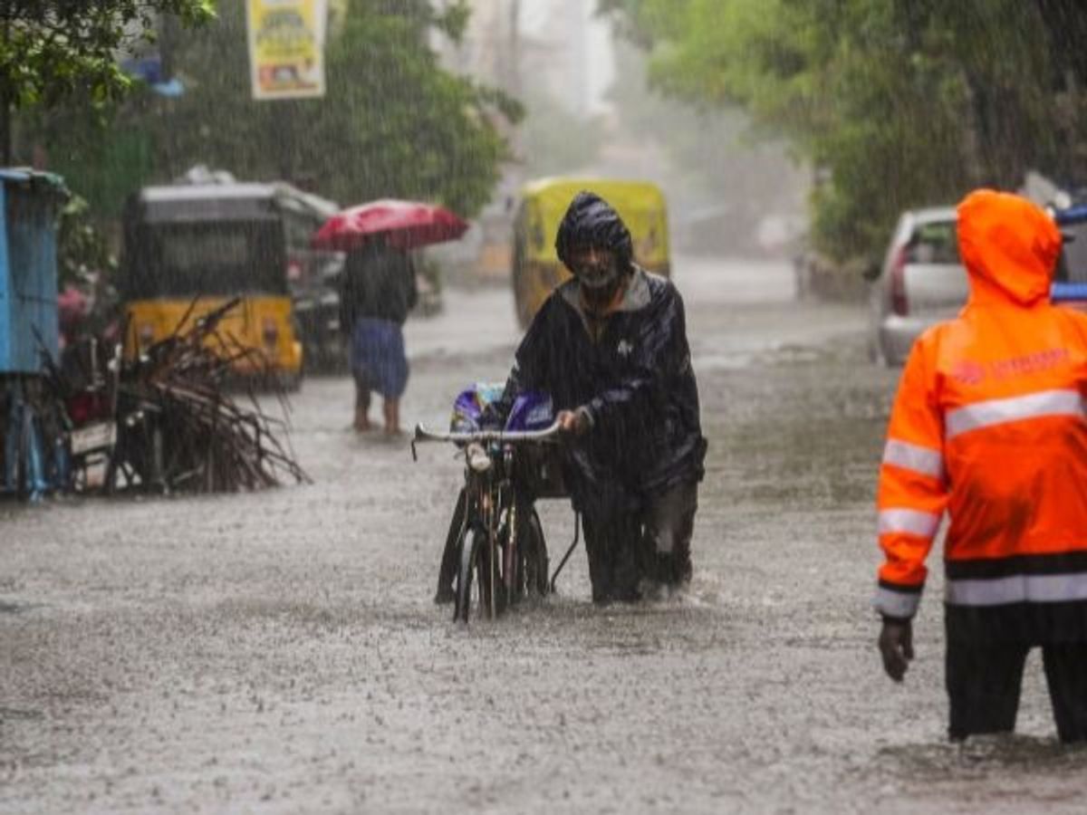 A commuter on a waterlogged road during heavy rain owing to Cyclone Michaung, in Chennai in the southern state of Tamil Nadu on, Monday, December 4, 2023.