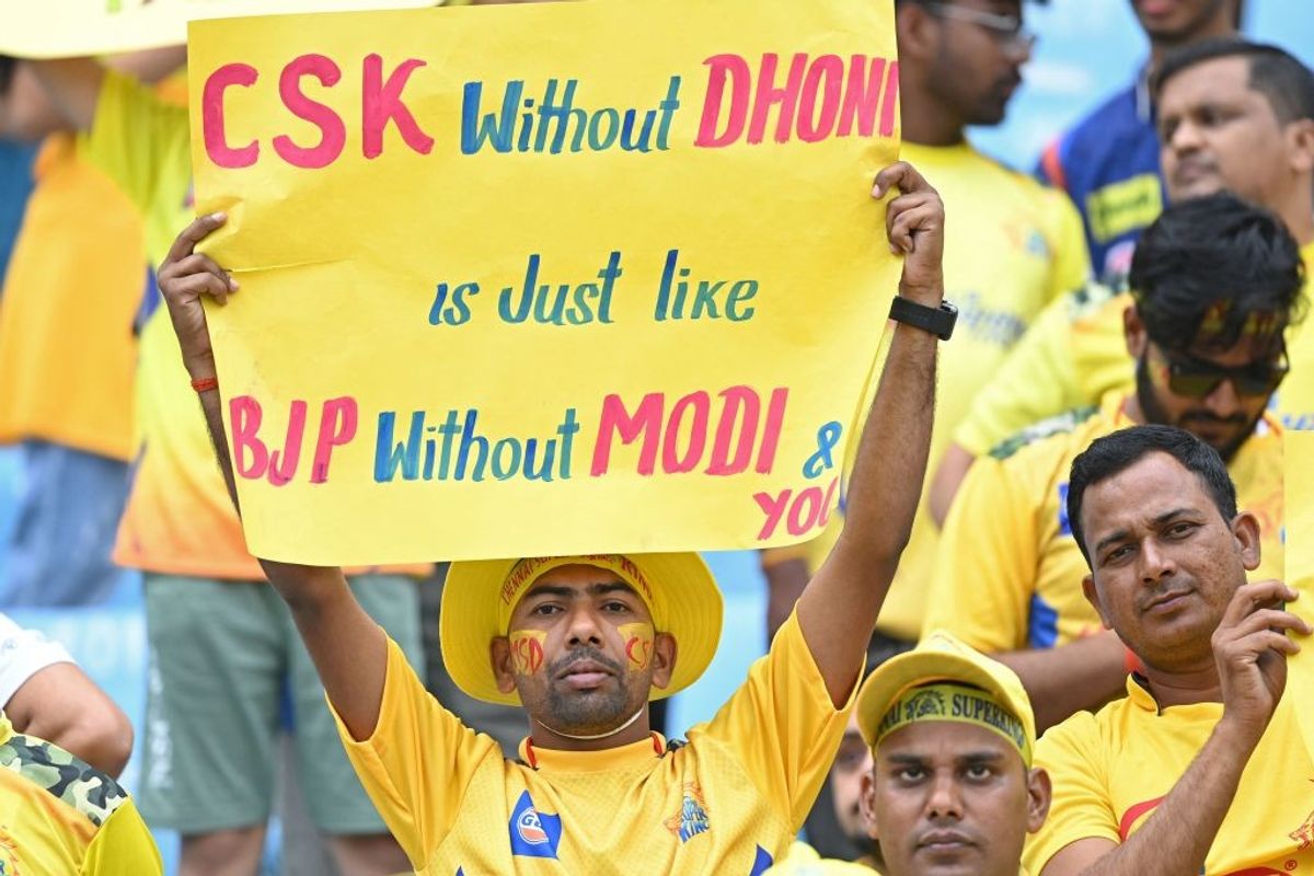 A fan of Chennai Super Kings' Mahendra Singh Dhoni, holds a placard during an IPL 2023 game