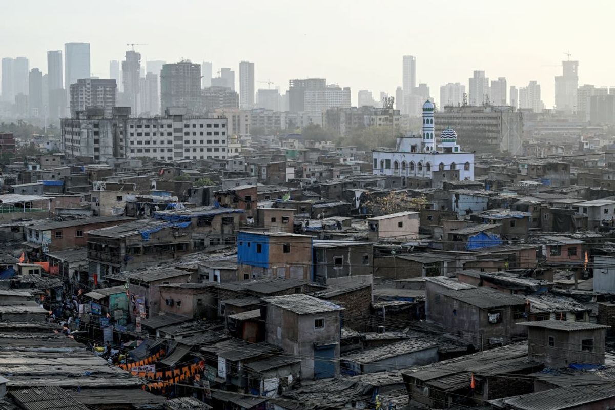 A general view of the Dharavi slums with high rise buildings seen in the background in the western Indian city of Mumbai