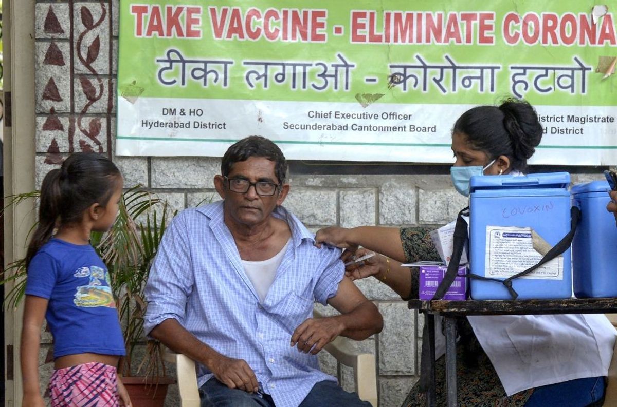 A health worker gives a Covishield vaccine to a woman in Hyderbad, India.