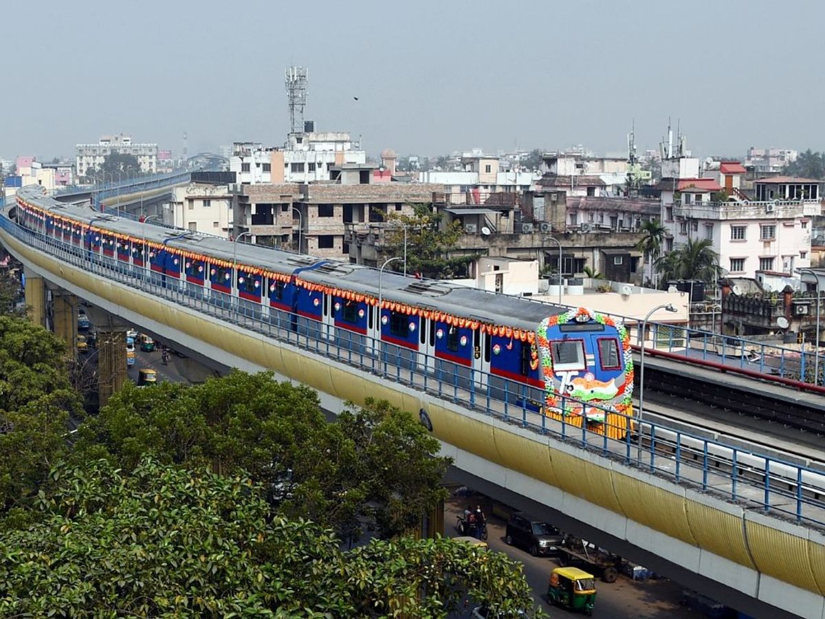 A Kolkata Metro Railway train runs on an elevated route in the city in West Bengal, India