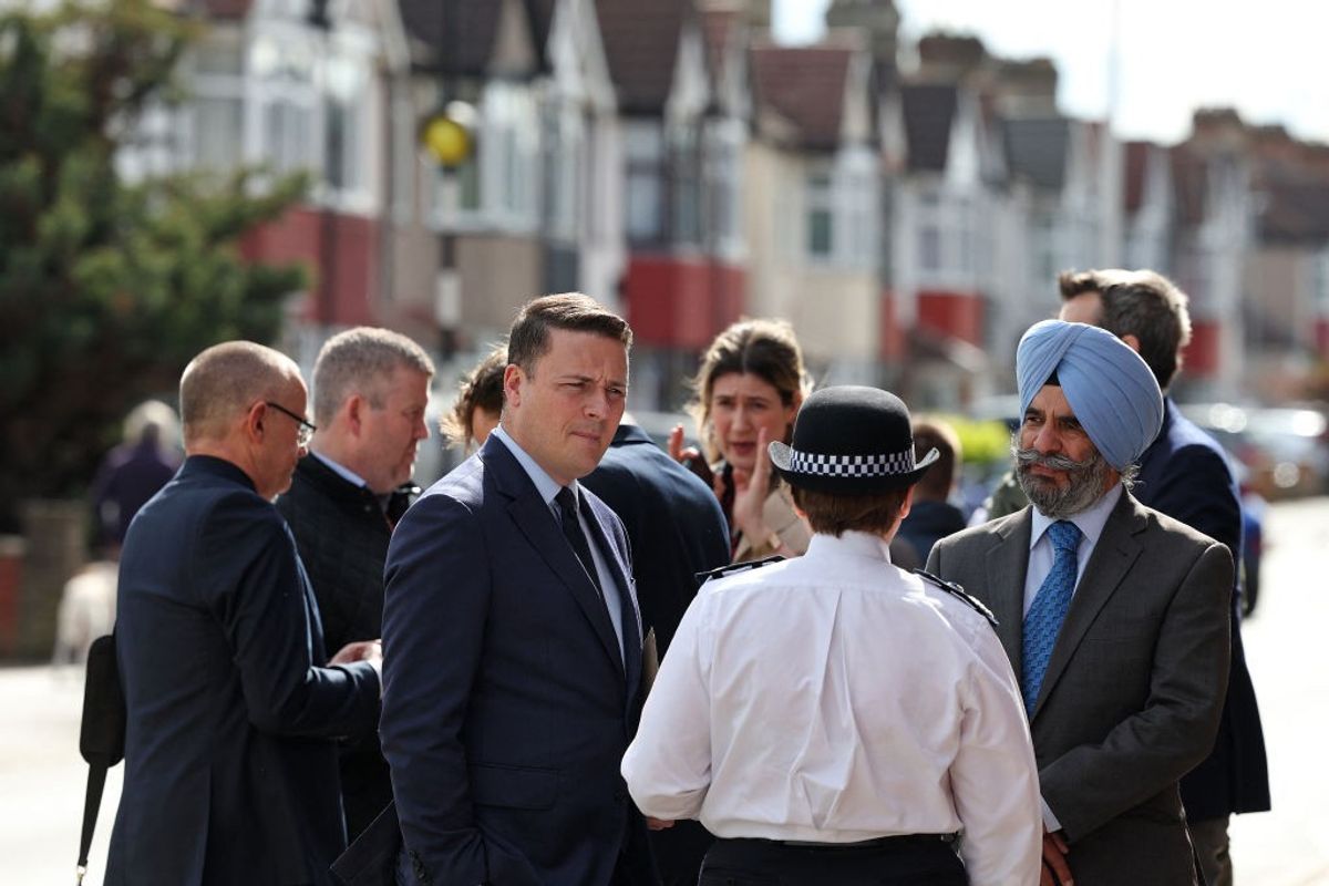 A man attacks people with sword in London, resulting in death of a 14-year-old boy.