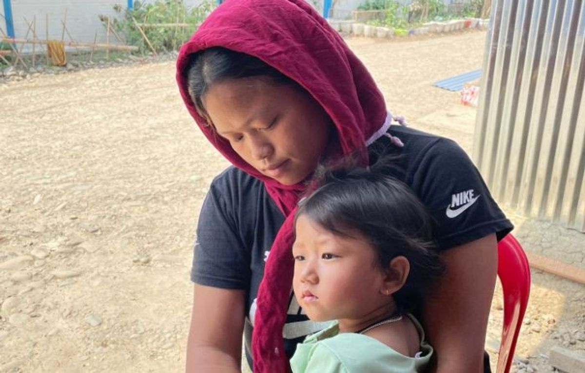 A Manipuri woman with her child