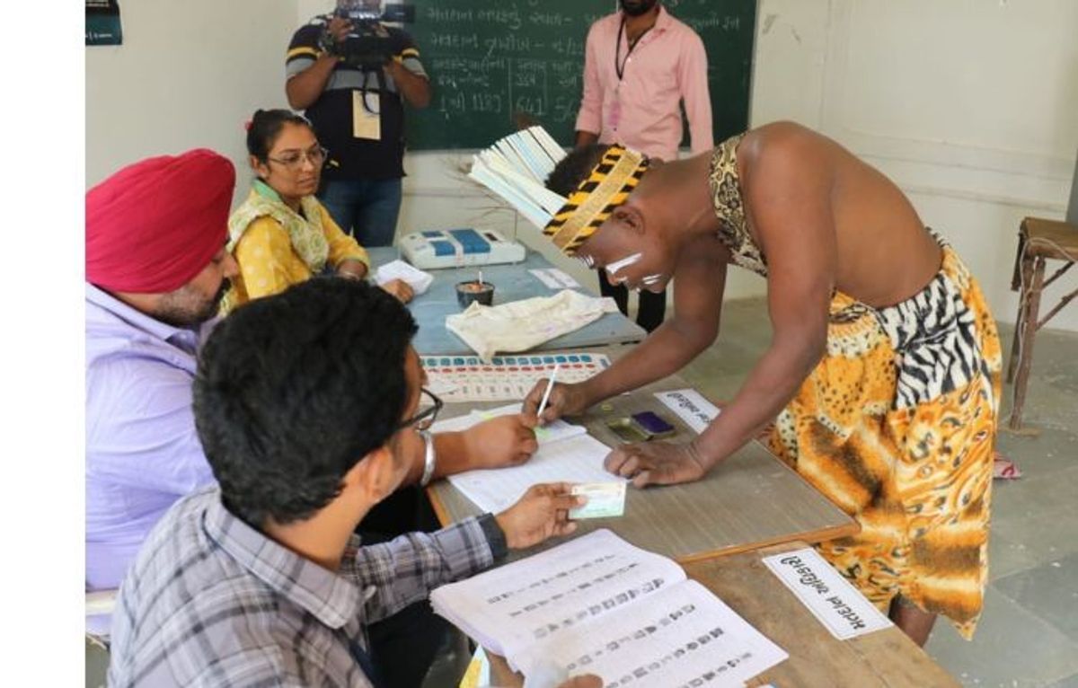 A member of the Siddi community casts his ballot in the western Indian state of Gujarat