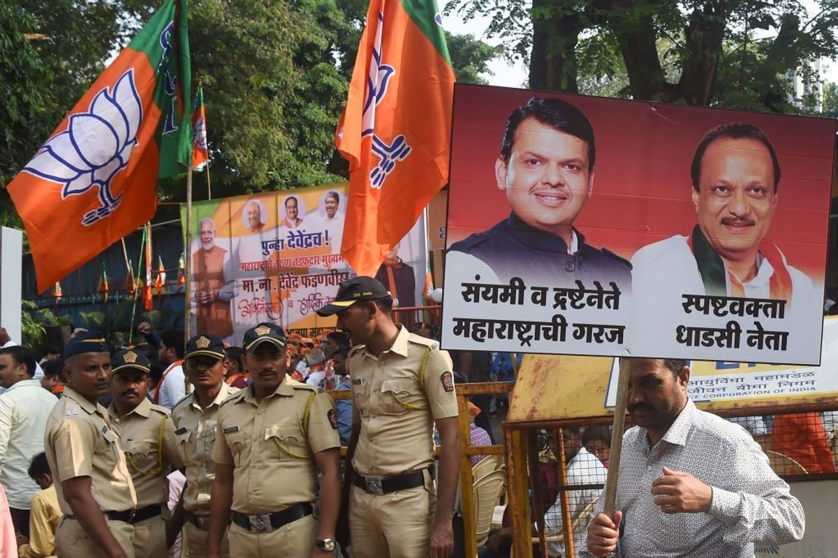 A poster featuring Maharashtra's two deputy chief ministers -- Devendra Fadnavis (L) and Ajit Pawar.
