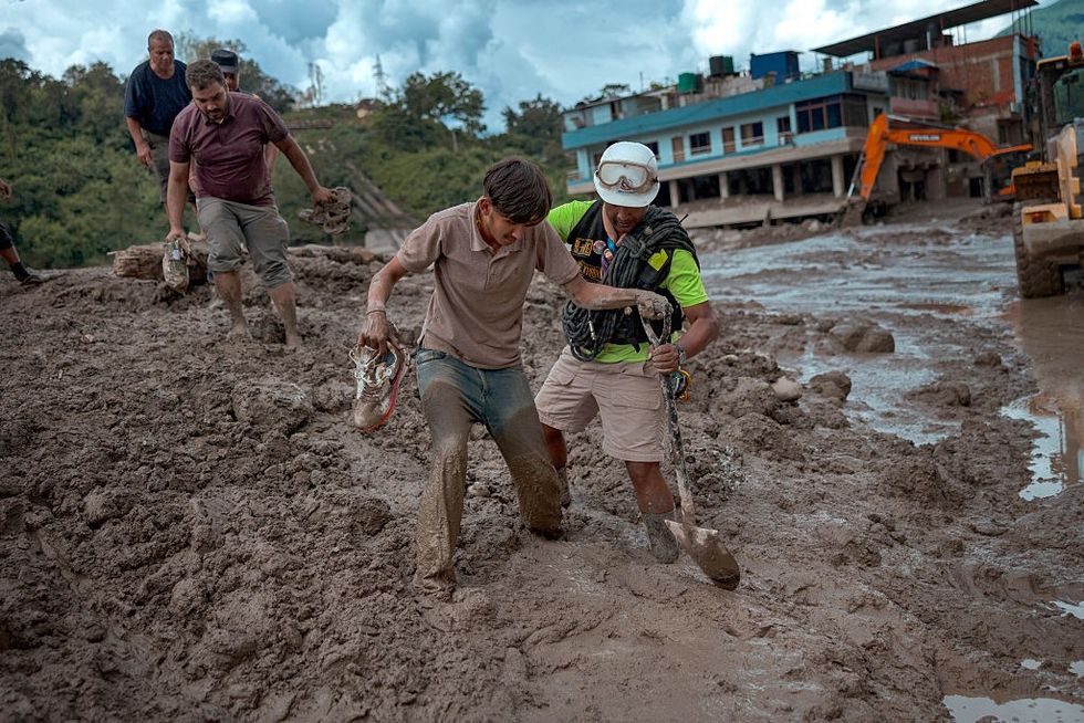 A rescuer assists a resident