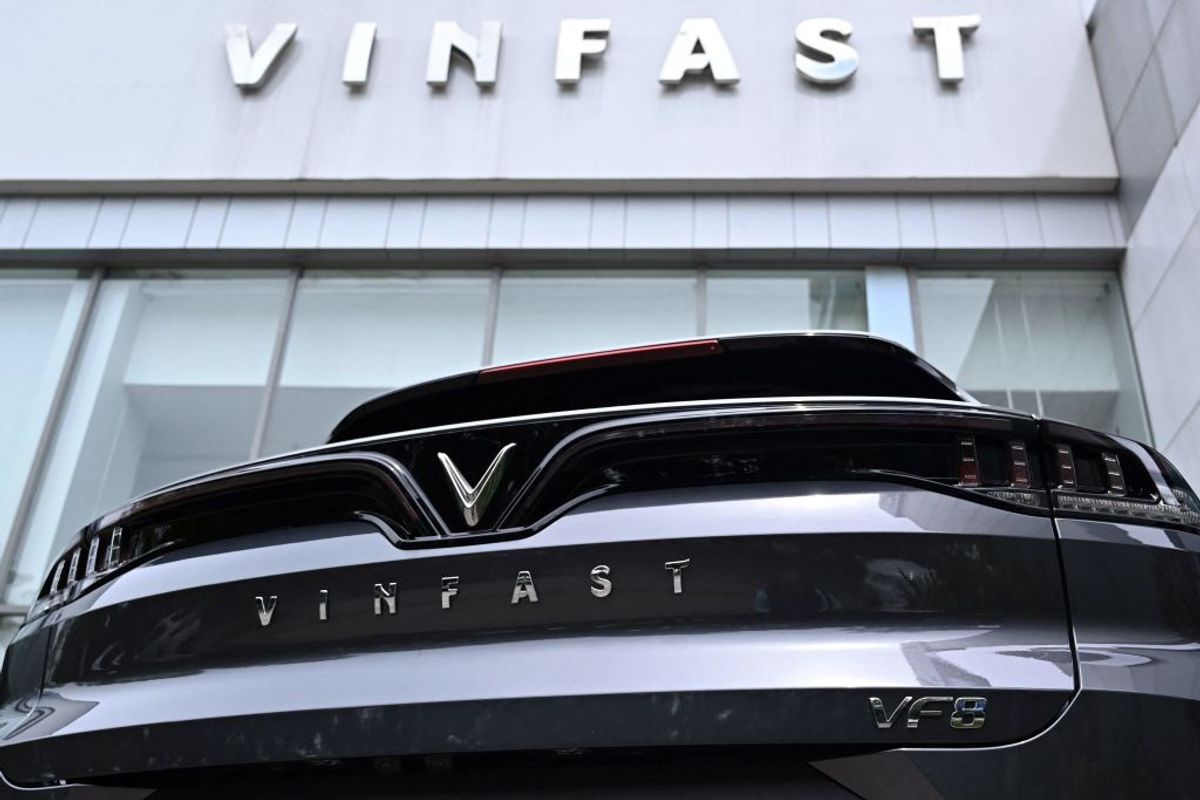 A Vinfast electric car is parked outside a showroom in Hanoi, Vietnam