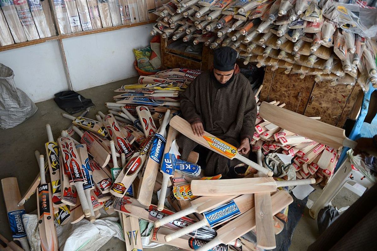 A worker works in a cricket-bat manufacturing unit in Kashmir, India.