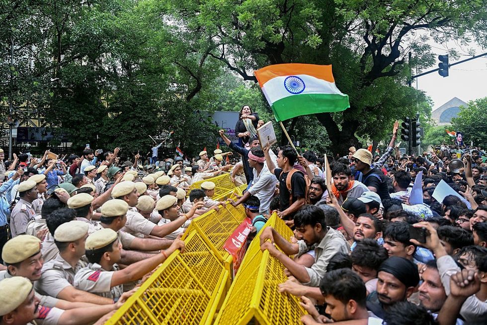 Activists and supporters of the Cockroach Janta Party (CJP)