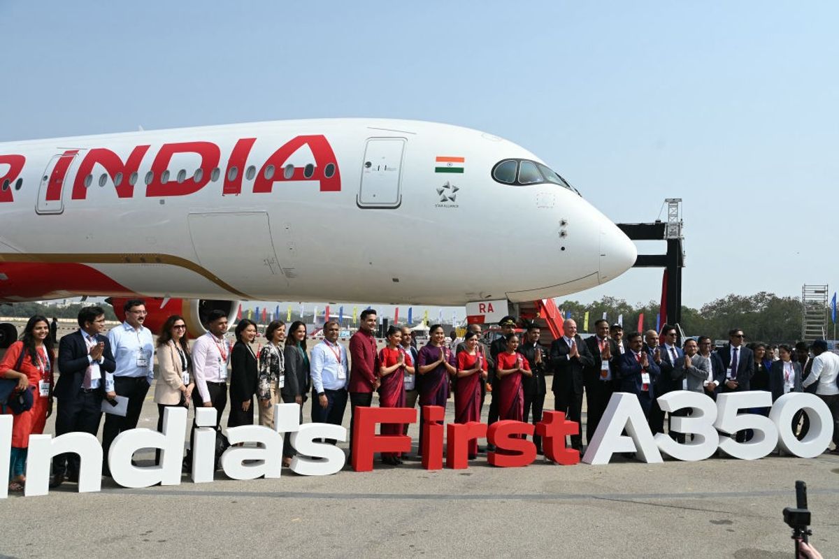 Air India crew members with an A350 aircraft