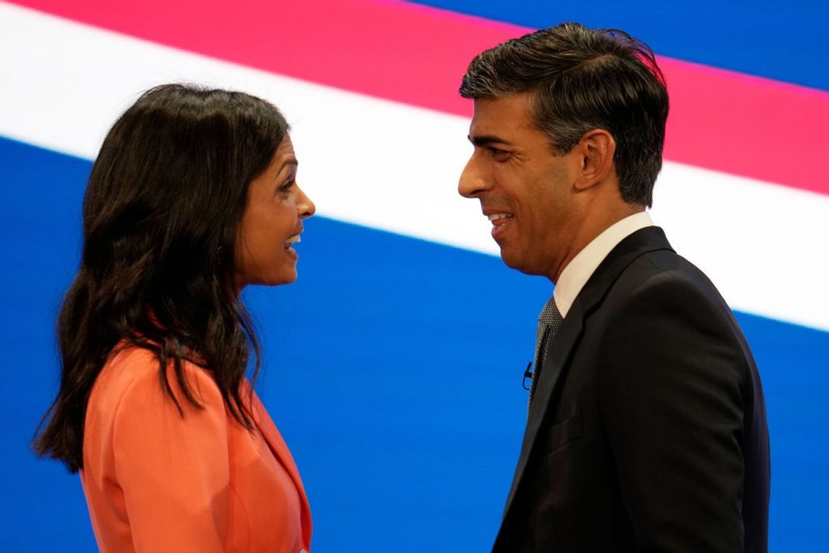 Akshata Murty embraces her husband prime minister Rishi Sunak during the final day of the Conservative Party Conference on October 4, 2023, in Manchester, England.