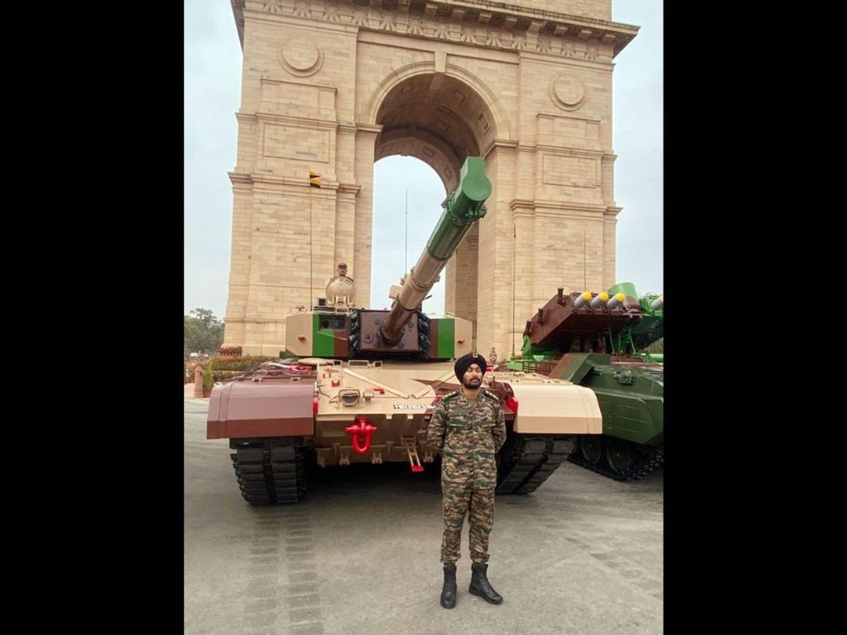 An Indian Army officer with an India-made tank in front of India Gate, New Delhi, ahead of Republic Day 2023 celebrations