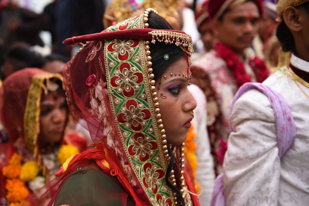 Tourists paying for tickets to attend Indian weddings