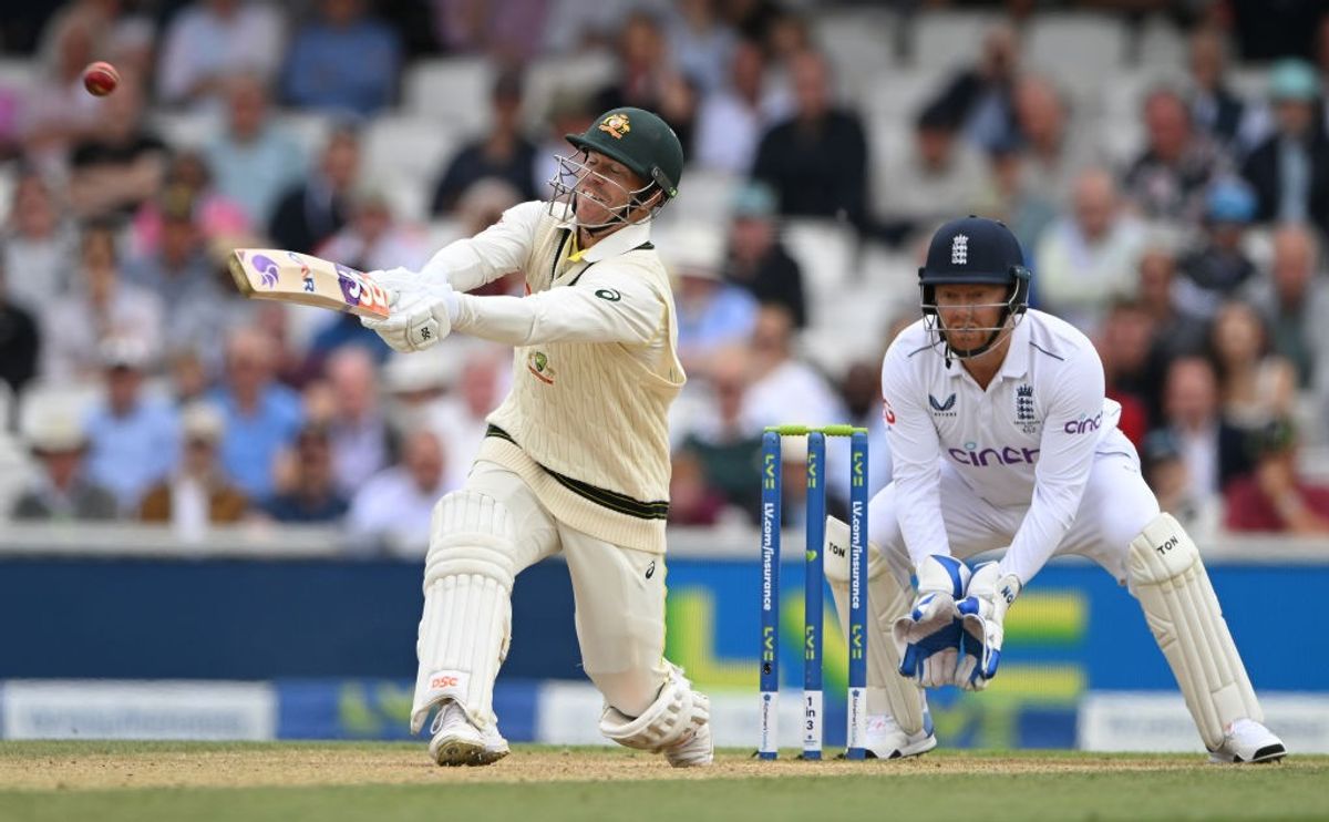 Australia batter David Warner hits out watched by England wicketkeeper Jonny Bairstow on Day 4 of the 5th Ashes Test match