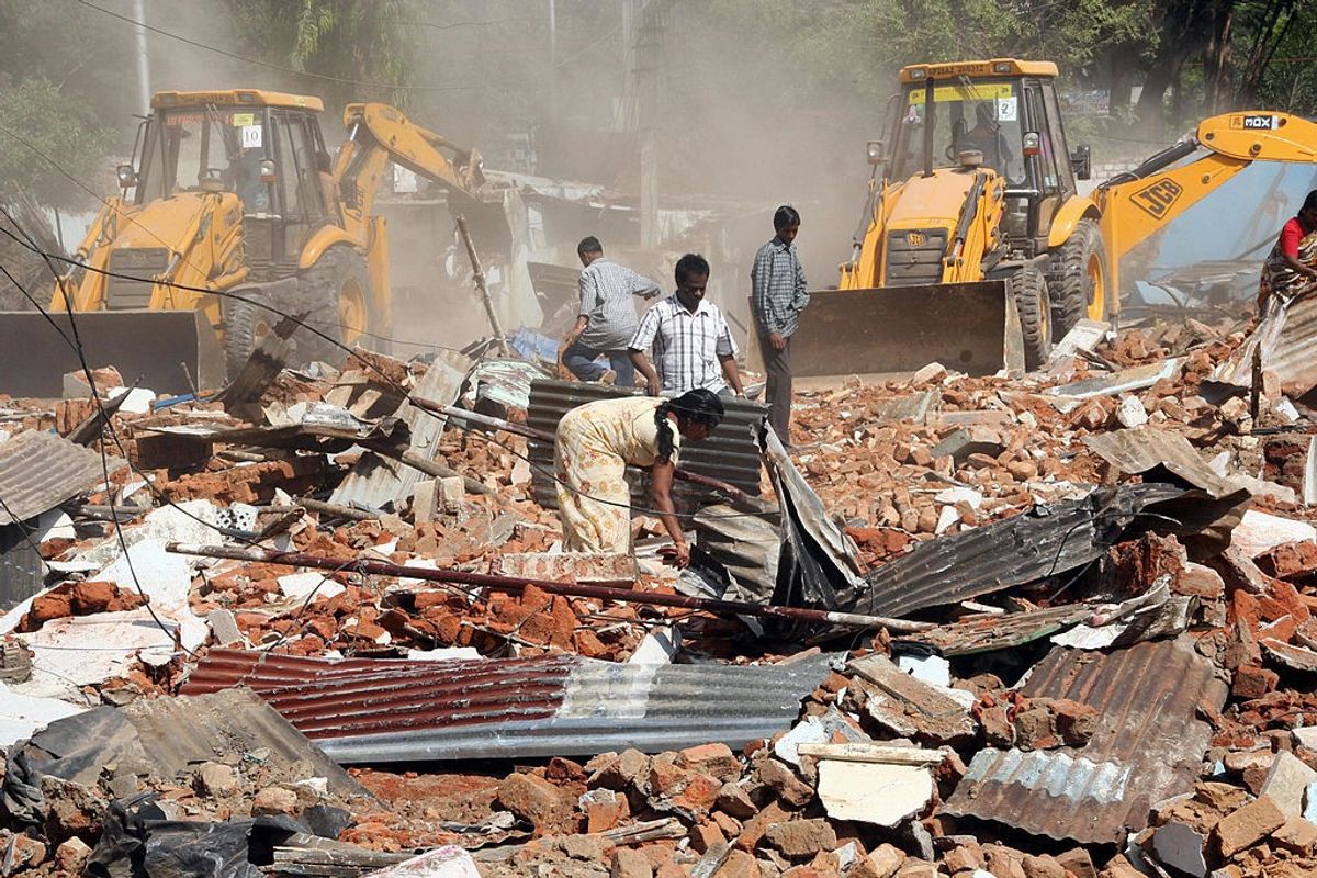 Bulldozers in action in a riot zone in India