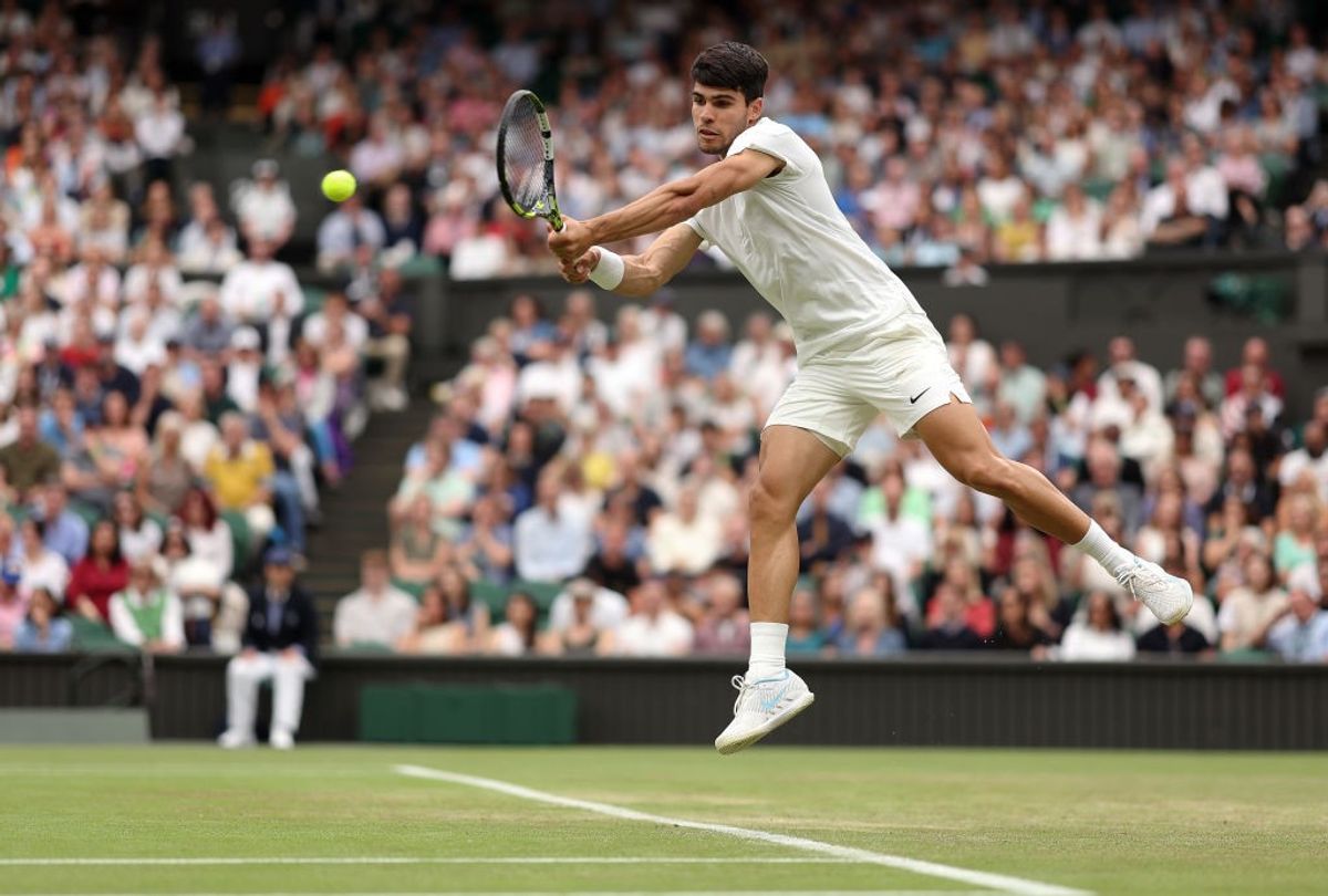 Carlos Alcaraz plays a shot during a game in Wimbledon 2024