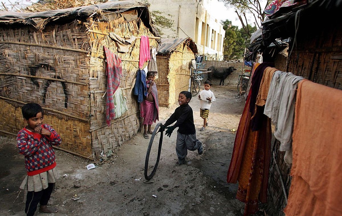 Children play in an urban slum on the outskirts of New Delhi, India