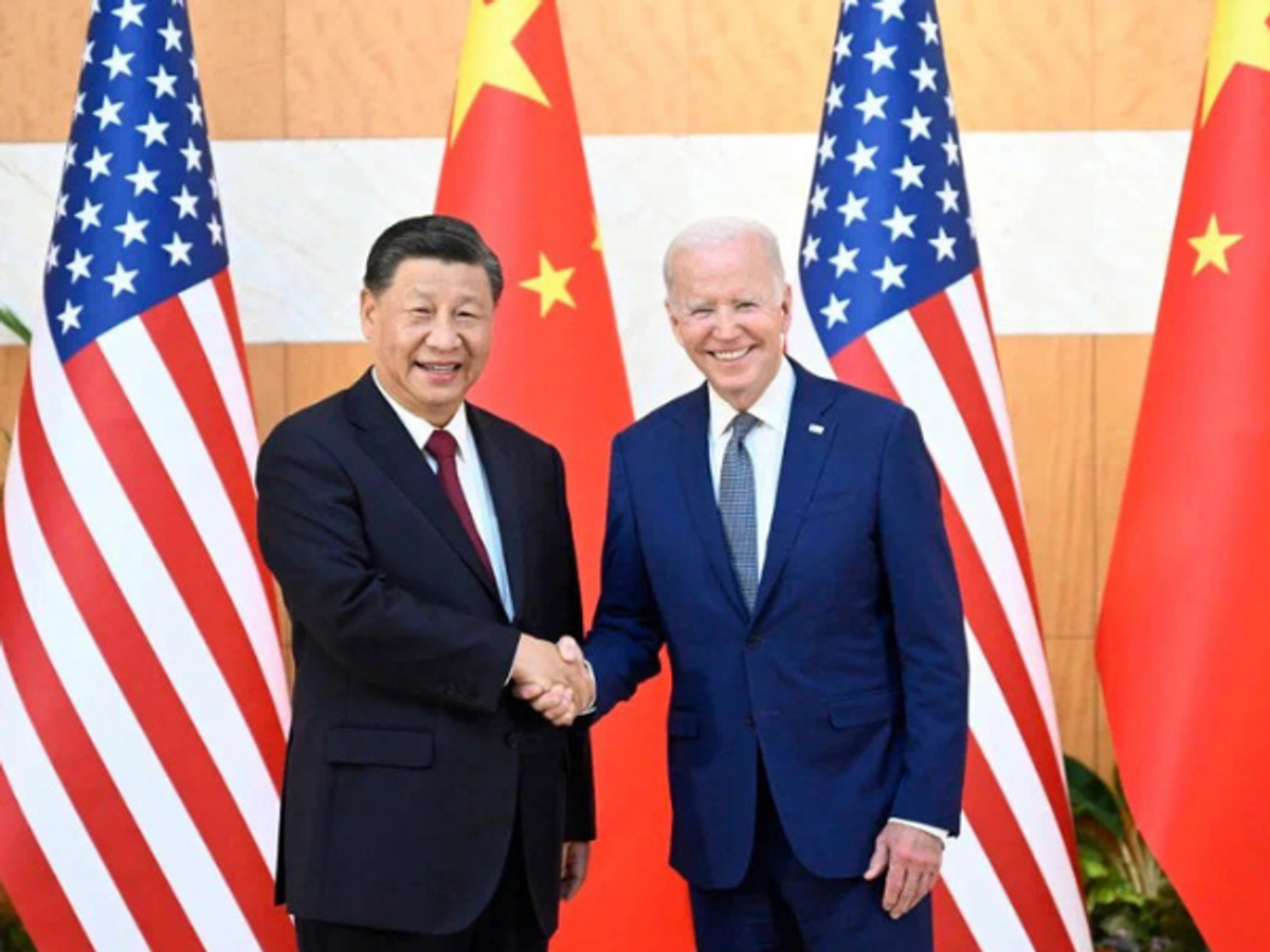Chinese president Xi Jinping (L) shakes hands with US counterpart Joe Biden