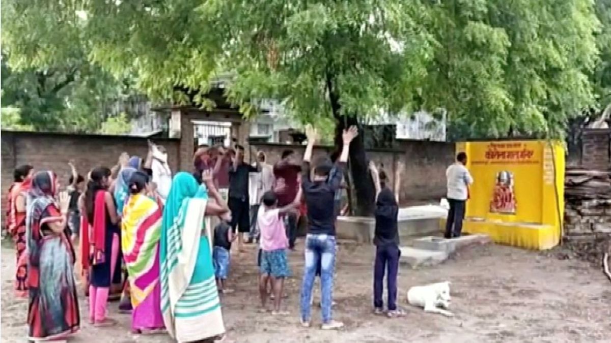 Devotees erect a shrine to 'goddess corona' in an Indian village