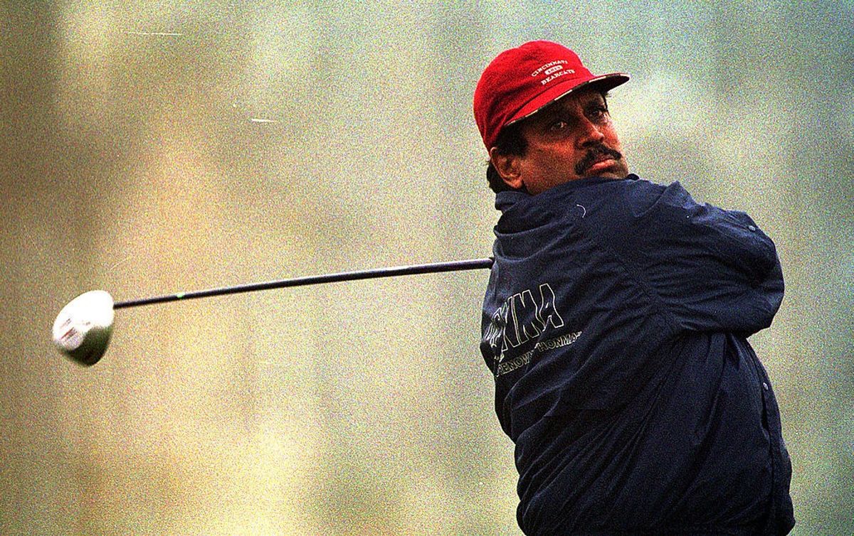 Former India cricket captain Kapil Dev plays golf