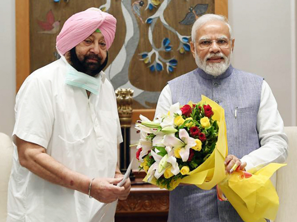 Former Punjab chief minister Amarinder Singh with Indian prime minister Narendra Modi