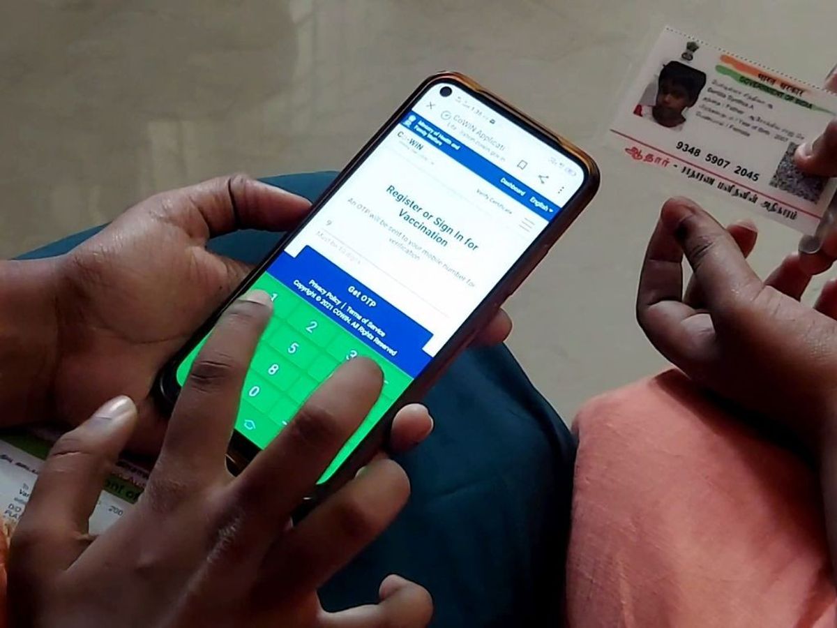 Girls between 15 and 18 years of age register for COVID-19 vaccination on the CoWIN platform, in Tiruchirappalli in the southern Indian state of Tamil Nadu