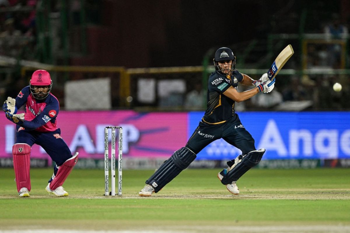 Gujarat captain Shubman Gill plays a shot against Rajasthan as his counterpart Sanju Samson looks on in IPL 2024