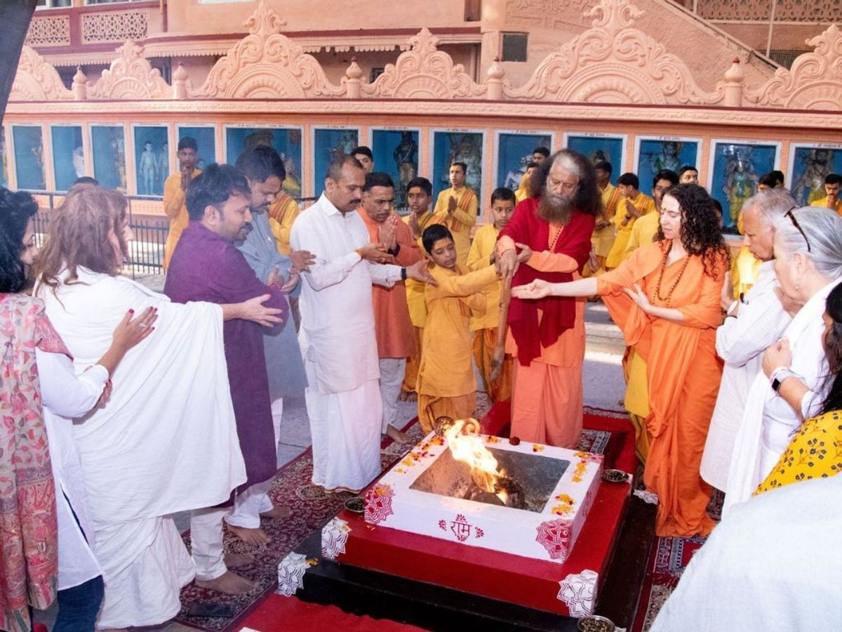 HH Pujya Chidanand Saraswatiji and Pujya Sadhvi Saraswatiji perform puja during a sacred fire ceremony on the eve of the International Yoga Festival at Parmarth Niketan in Rishikesh, Uttarakhand, India.