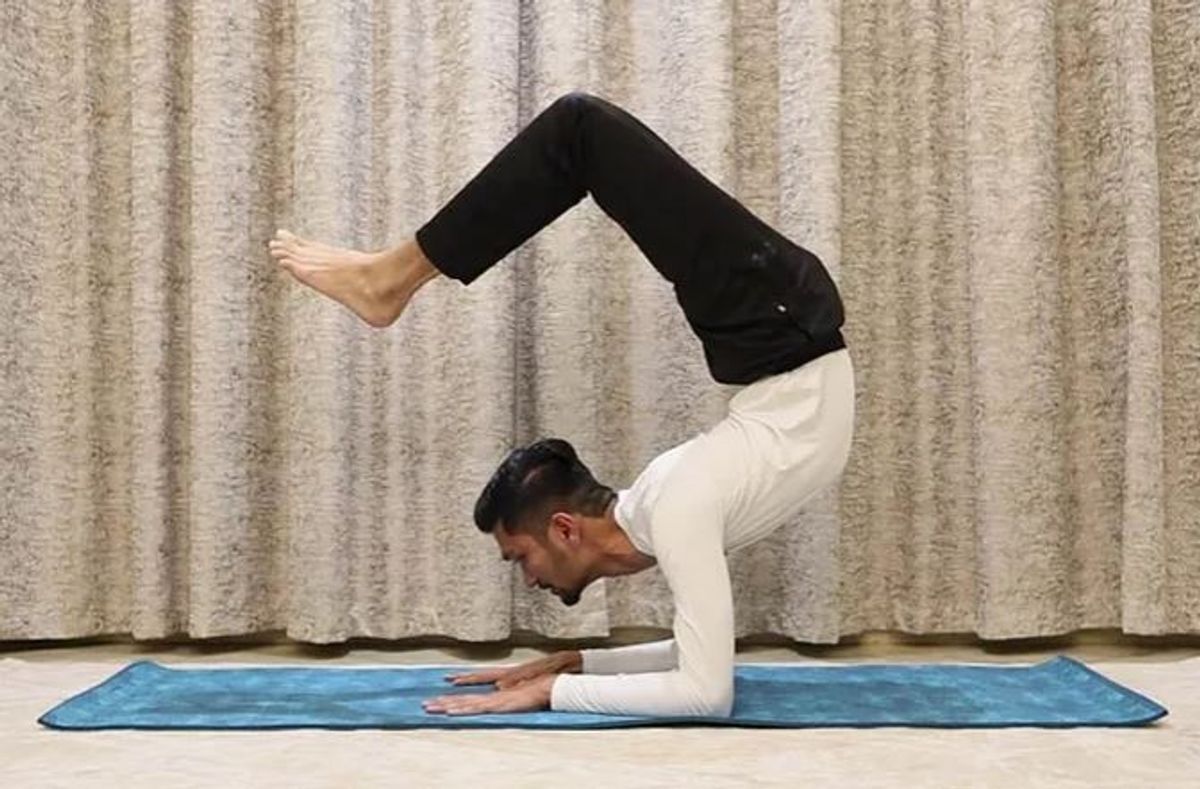 Watch: Indian man holds scorpion pose for 29 minutes, creates world record