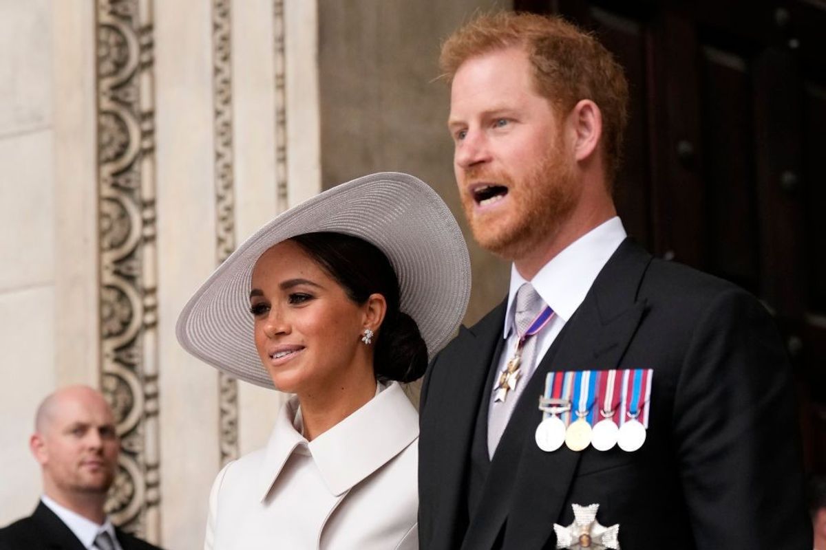 Cheers and some jeers as Prince Harry and Meghan return to UK