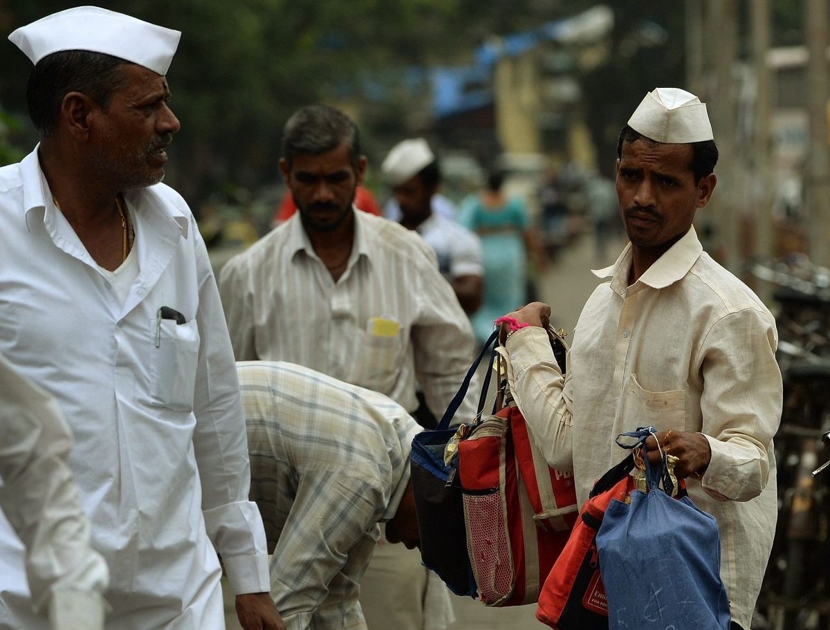Coronation: Mumbai’s dabbawalas gift traditional headgear