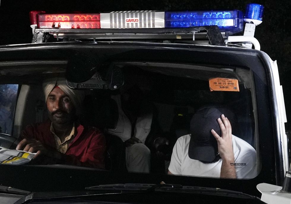 'We were handcuffed', claim deportees who arrived in second plane from US