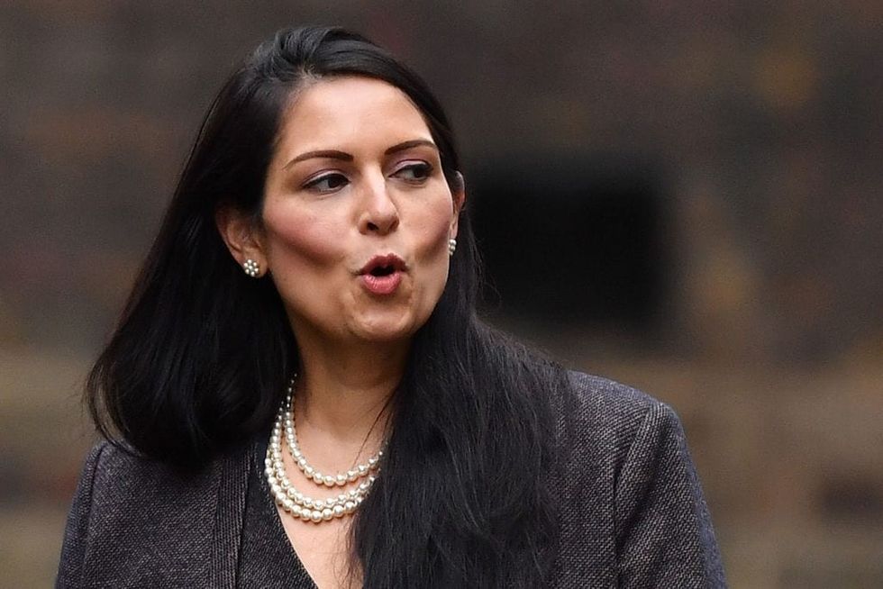 Priti Patel is target of ‘smear campaign’, say nearly 100 allies