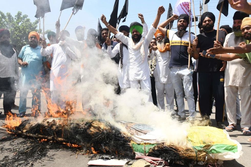 Indian farmers observe 'black day' as protest completes six months