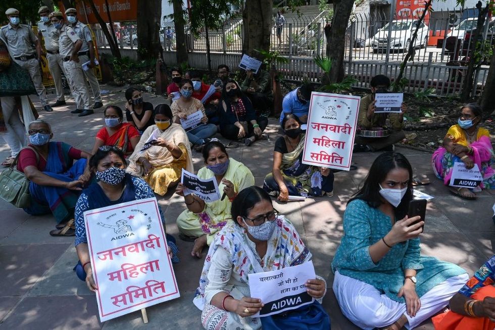 Four men including a priest charged with rape, murder of nine-year-old Indian girl