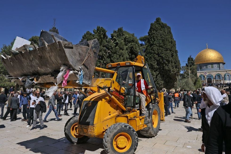 WATCH: Indian man goes to his wedding riding not car or horse but a bulldozer!