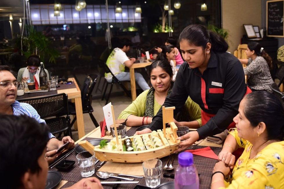 India bars hotels, restaurants from raising service charge