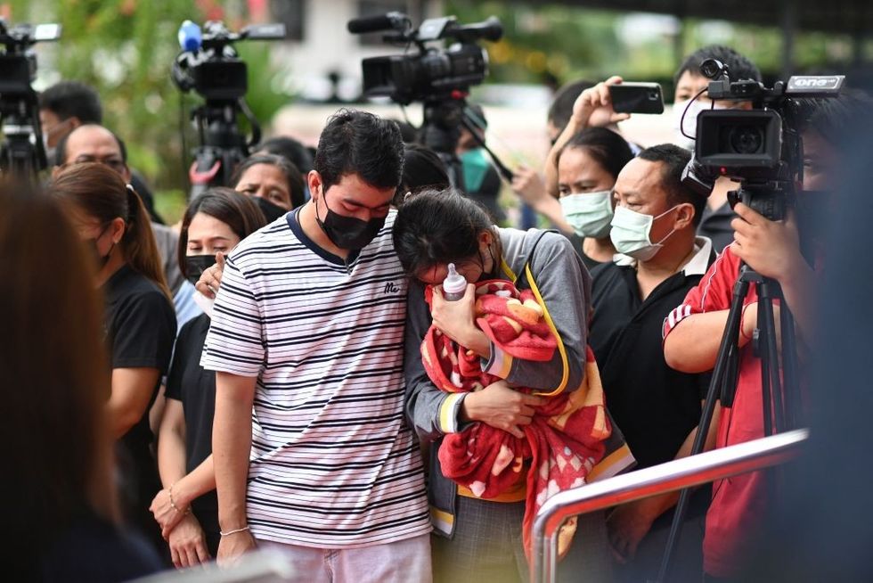 Thailand nursery massacre: Distraught parents lay white roses for victims
