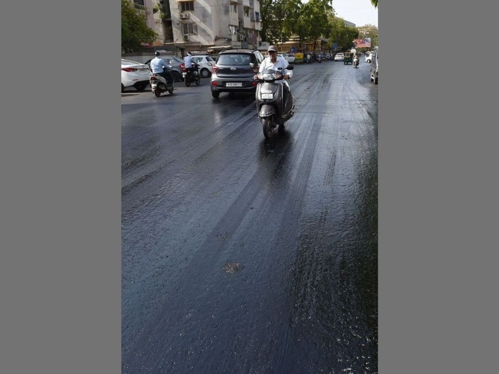 Roads in Gujarat melt in ruthless Indian summer; commuters find it tough with sticking shoes, tyres