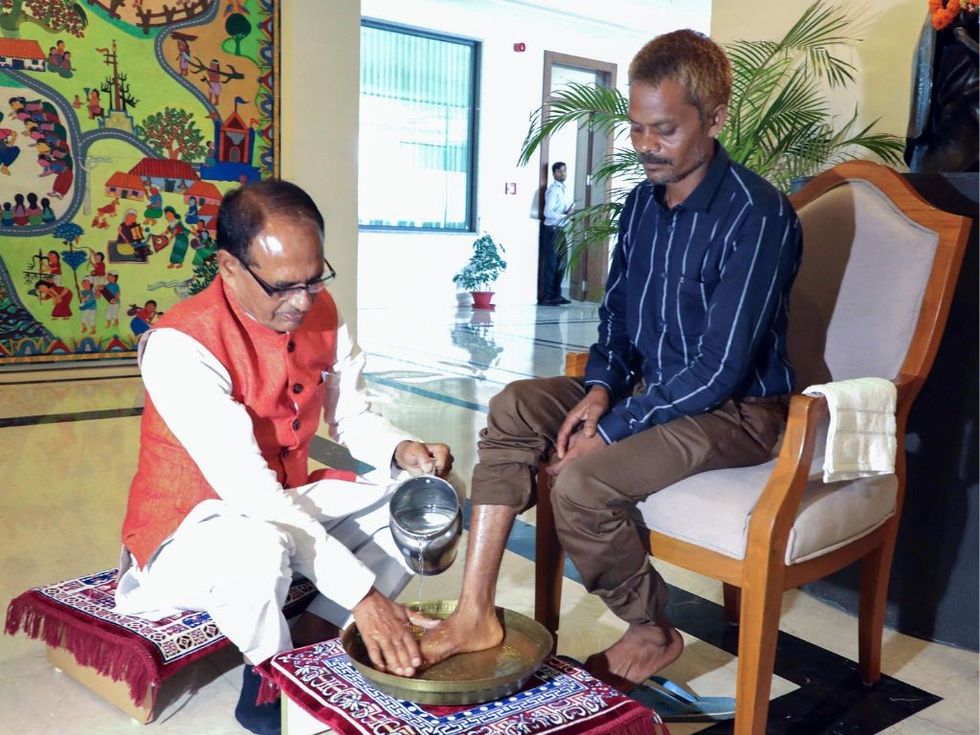 Chief minister of India's poll-bound Madhya Pradesh washes feet of tribal who was urinated upon: 'I apologise'