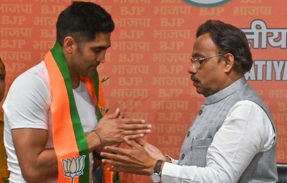 A day after retweeting opposition leader's post targeting Modi, India's Olympic medal-winning pugilist joins his BJP