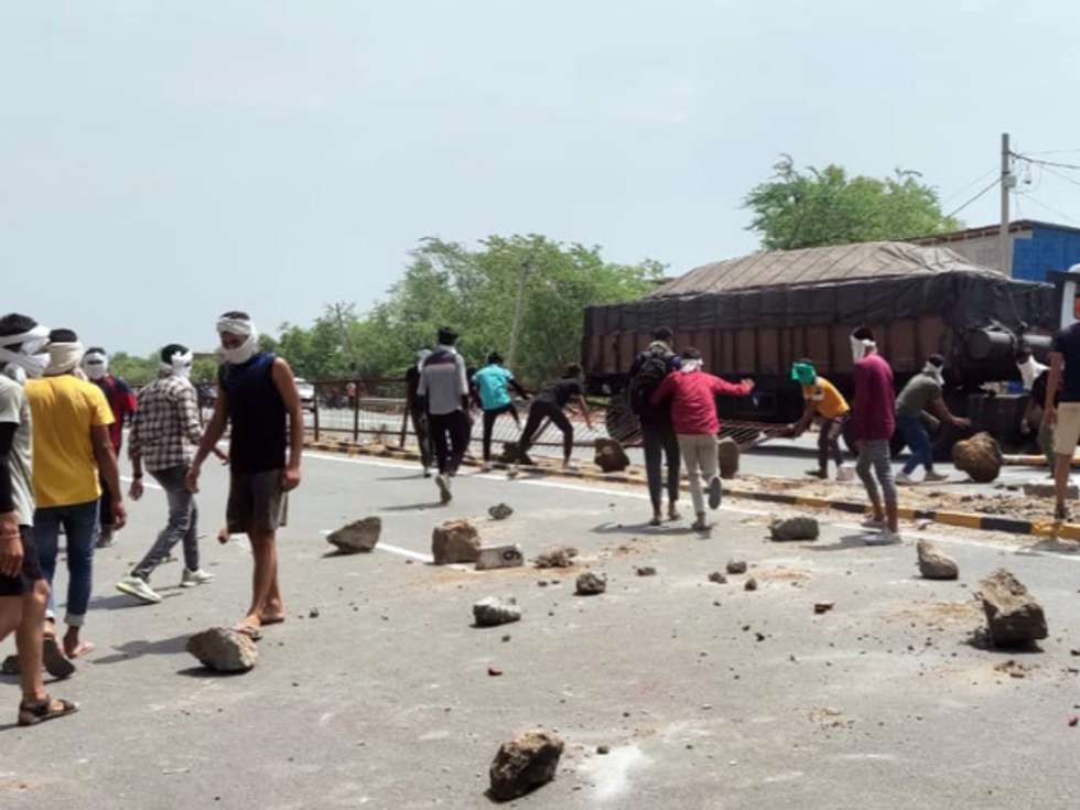 WATCH: Kids cry as school bus gets stuck in India violence