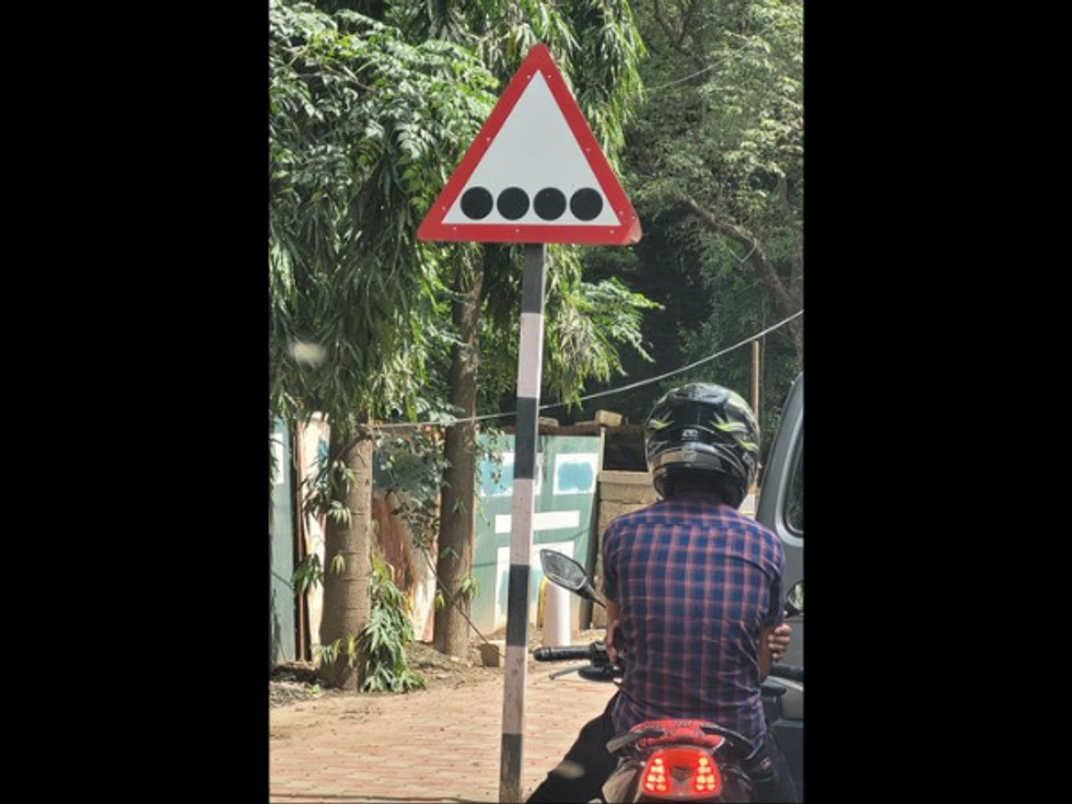 Curious Twitter have fun time over unusual road sign in Bengaluru: 'Potholes ahead'