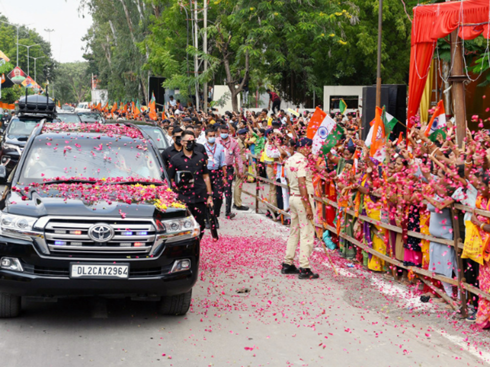 Modi holds mega roadshows in Gujarat; his car showered with rose petals in Bhavnagar