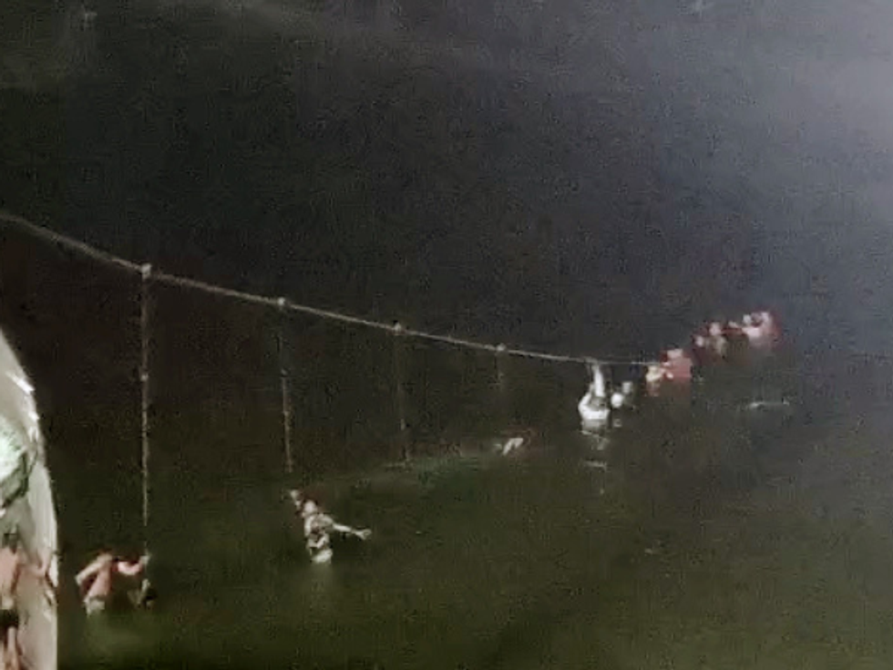 At least 30 killed after 100-year-old suspension bridge collapses in Gujarat