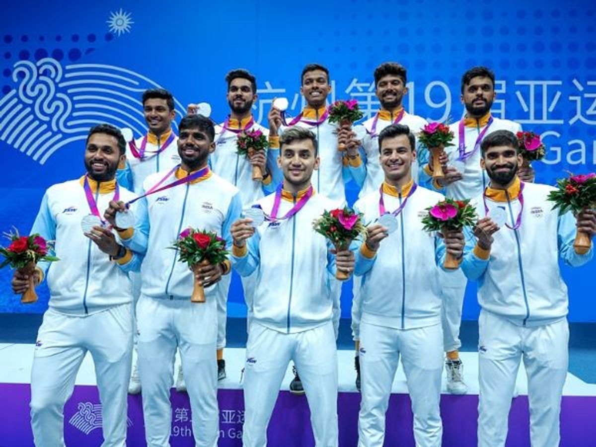 India badminton players pose with the silver medal in the men's tournament at 2023 Asian Games in Hangzhou, China