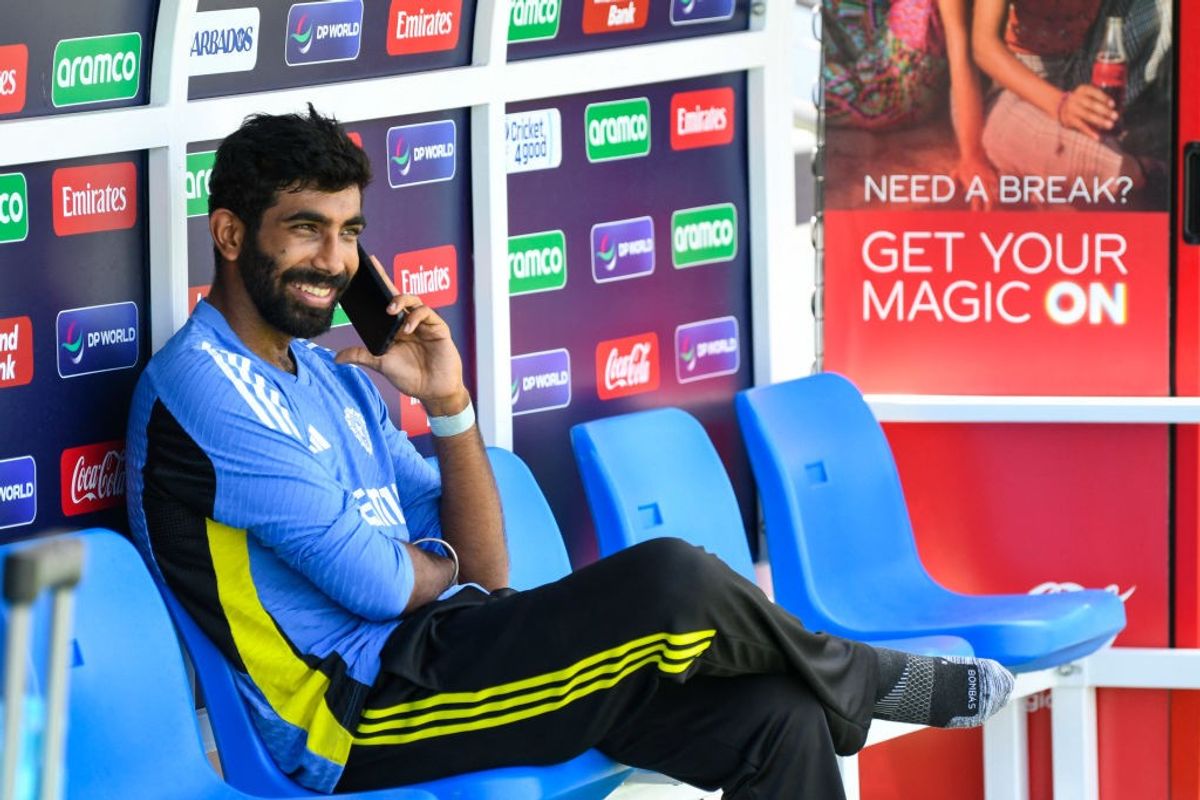 India bowler Jasprit Bumrah speaks over the phone during a break in a training session.