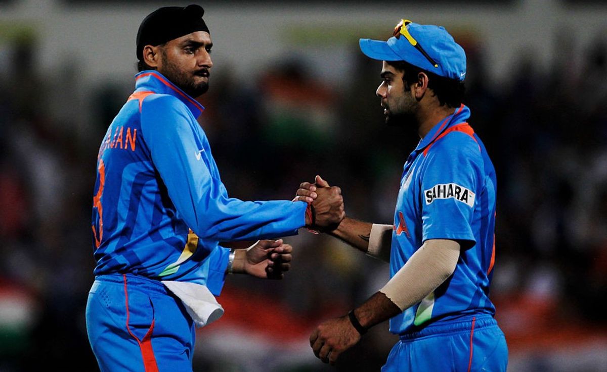 India cricketer Virat Kohli with former teammate Harbhajan Singh