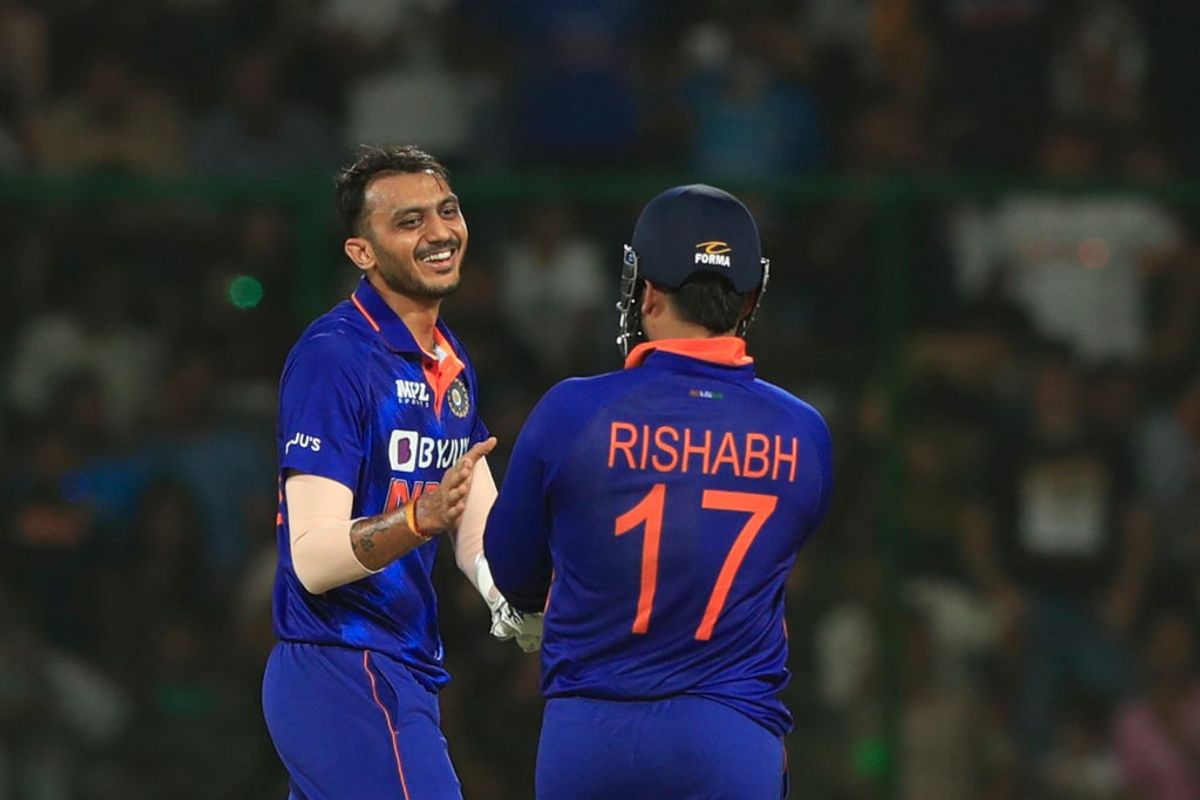 India cricketers Axar Patel and Rishabh Pant celebrate fall of a opponent wicket in a white-ball match in Delhi