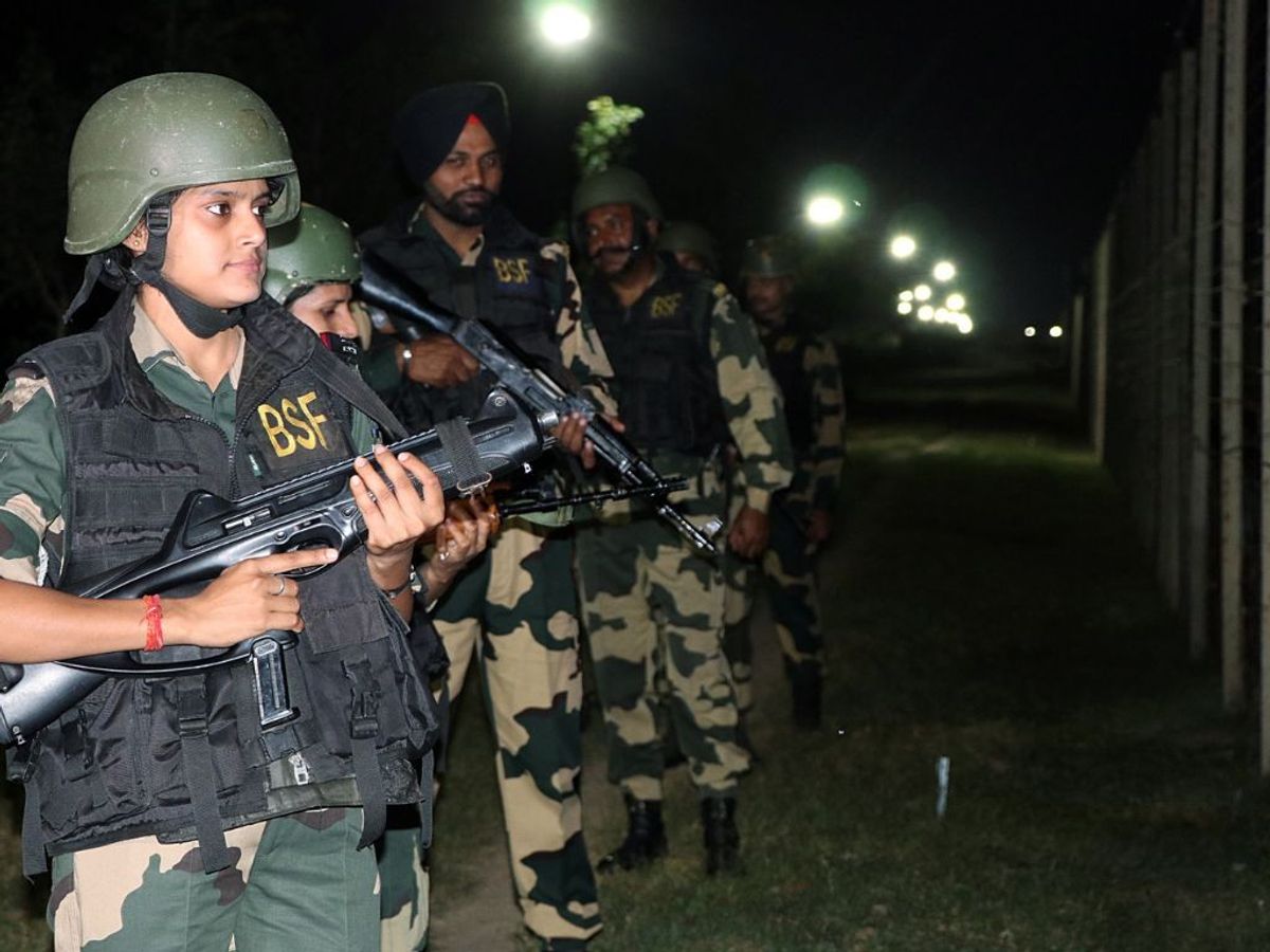 India's Border Security Force (BSF) personnel patrol along the Pakistan border in Jammu, Jammu and Kashmir.